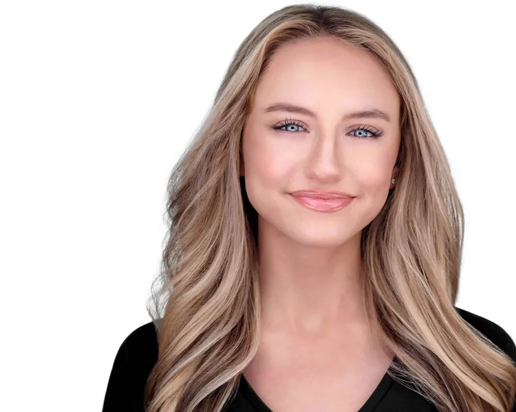 Professional performer headshot of young female singer and actor with long blonde highlighted hair styled with center part and warm natural smile wearing black v-neck top photographed against white studio background by Richard Waine Photography Lancaster Pennsylvania, acting headshots, professional acting headshots, actor headshots near me